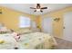 Inviting bedroom features twin beds, a ceiling fan, and a spacious closet at 22375 Edgewater Dr # 149, Punta Gorda, FL 33980