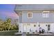 Charming condo featuring white and gray exterior, walkway, and decorative plants enhancing curb appeal at 22375 Edgewater Dr # 149, Punta Gorda, FL 33980