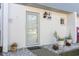 Inviting front entrance featuring a stylish light fixture and well-tended plants at 22375 Edgewater Dr # 149, Punta Gorda, FL 33980