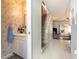Hallway with half-bath and view to living room and stairway at 22375 Edgewater Dr # 149, Punta Gorda, FL 33980