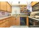Efficient kitchen with wood cabinets and standard appliances at 22375 Edgewater Dr # 149, Punta Gorda, FL 33980