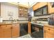 Compact kitchen features ample cabinet space and essential appliances at 22375 Edgewater Dr # 149, Punta Gorda, FL 33980