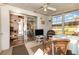 Spacious sunroom with a ceiling fan and a view into the living room and backyard at 22375 Edgewater Dr # 149, Punta Gorda, FL 33980