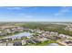 Panoramic aerial view of a neighborhood featuring ponds, lush green spaces, and well-maintained homes at 2486 Buckthorn Loop, North Port, FL 34289