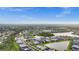 Expansive aerial view showcasing a community with lakes, green spaces, and numerous residential homes at 2486 Buckthorn Loop, North Port, FL 34289