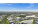 Expansive aerial view showcasing a community with lakes, green spaces, and numerous residential homes at 2486 Buckthorn Loop, North Port, FL 34289