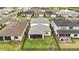 Aerial view of a home showcasing its fenced backyard and outdoor living spaces in a suburban community at 2486 Buckthorn Loop, North Port, FL 34289