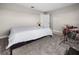 Bright, carpeted bedroom featuring neutral colors, large windows, and space for musical expression at 2486 Buckthorn Loop, North Port, FL 34289