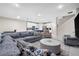 Spacious open-concept area blending a large sectional with a well-equipped kitchen, ideal for gatherings and daily life at 2486 Buckthorn Loop, North Port, FL 34289