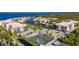 Aerial view of a waterfront community with tennis courts, a pool, and boat docks at 25188 Marion Ave # D303, Punta Gorda, FL 33950