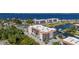 Aerial view of the complex with waterfront access, boat docks, a pool, and tennis courts at 25188 Marion Ave # D303, Punta Gorda, FL 33950