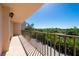 A sunlit balcony offers lovely views of the surrounding nature and nearby street at 25188 Marion Ave # D303, Punta Gorda, FL 33950