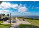 Enjoy outdoor dining with waterfront views in this community area featuring tables, seating, and a grill at 25188 Marion Ave # D303, Punta Gorda, FL 33950