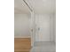 View of entrance hallway featuring tiled floors and bright white walls at 25188 Marion Ave # D303, Punta Gorda, FL 33950