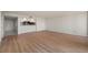 Large living area with laminate flooring and a neutral color palette, ready for personal touches at 25188 Marion Ave # D303, Punta Gorda, FL 33950