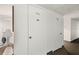 Hallway with white storage units, providing convenient and secure storage space at 25188 Marion Ave # D303, Punta Gorda, FL 33950
