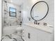 Elegant bathroom with marble accents, a spacious vanity, and modern fixtures at 260 Long Meadow Ln, Rotonda West, FL 33947