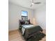 Cozy bedroom features a plush rug, modern ceiling fan, and a window offering natural light at 260 Long Meadow Ln, Rotonda West, FL 33947