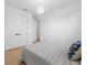 Bright bedroom featuring light-colored wood floors and ample closet space at 260 Long Meadow Ln, Rotonda West, FL 33947