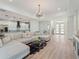 Spacious open-concept, showcasing modern finishes, elegant decor, and seamless flow to kitchen area at 260 Long Meadow Ln, Rotonda West, FL 33947