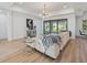 Inviting living room with stylish furniture, modern light fixture, and serene views of the backyard at 260 Long Meadow Ln, Rotonda West, FL 33947