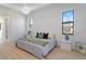 Relaxing main bedroom featuring modern lamps, decorative pillows, and neutral tones at 260 Long Meadow Ln, Rotonda West, FL 33947