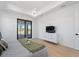 Main bedroom features modern lighting, access to the patio, and neutral tones at 260 Long Meadow Ln, Rotonda West, FL 33947