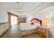 Spacious bedroom featuring a decorative bed, ample natural light, and built-in bookcase at 26389 Villa Maria Dr, Punta Gorda, FL 33983