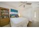 Cozy bedroom featuring a book shelf, a plush bed, and natural light at 26389 Villa Maria Dr, Punta Gorda, FL 33983