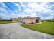 Charming single-story home with a well-maintained lawn and colorful landscaping, offering curb appeal and a welcoming entrance at 26389 Villa Maria Dr, Punta Gorda, FL 33983