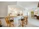 Open kitchen with breakfast bar and lots of natural light, ideal for casual dining at 26389 Villa Maria Dr, Punta Gorda, FL 33983