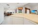 Bright, airy kitchen with breakfast bar flows into casual living and office spaces at 26389 Villa Maria Dr, Punta Gorda, FL 33983