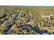 An aerial shot of a residential area featuring attractive homes surrounded by mature trees at 267 Camrose St, Port Charlotte, FL 33954