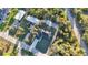 An aerial shot of a single Gathering home with a well manicured lawn, and a lengthy driveway at 267 Camrose St, Port Charlotte, FL 33954