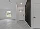 Modern foyer with a gray tiled floor and white doors at 267 Camrose St, Port Charlotte, FL 33954