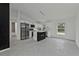 Open-concept kitchen with modern appliances, a center island, and ample counter space at 267 Camrose St, Port Charlotte, FL 33954