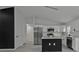 Bright, open kitchen featuring a center island with seating and modern appliances at 267 Camrose St, Port Charlotte, FL 33954