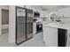 Open concept kitchen with modern stainless steel appliances and stylish design elements at 267 Camrose St, Port Charlotte, FL 33954