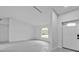 Bright living room featuring neutral paint, modern tile floors, and a window view at 267 Camrose St, Port Charlotte, FL 33954