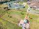 An aerial shot of the dog park, tennis courts, and recreational facilities within the Riverwood community at 2676 Wax Myrtle Ct, Port Charlotte, FL 33953