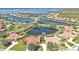 Beautiful aerial shot of a community with a lake and well-maintained homes at 2676 Wax Myrtle Ct, Port Charlotte, FL 33953