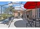 Outdoor patio boasts ample seating and shade, perfect for dining and entertaining at 2676 Wax Myrtle Ct, Port Charlotte, FL 33953