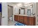 Spacious bathroom with double vanity, ample storage, and tile flooring at 3322 Purple Martin Dr # 127, Punta Gorda, FL 33950