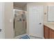 Bathroom featuring tiled floors, glass shower, and neutral wall paint at 3322 Purple Martin Dr # 127, Punta Gorda, FL 33950