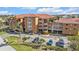 Condominium building with a tile roof and multiple levels with parking at 3322 Purple Martin Dr # 127, Punta Gorda, FL 33950