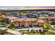 Beautiful waterfront condo building featuring a tile roof and lush landscaping in a serene community at 3322 Purple Martin Dr # 127, Punta Gorda, FL 33950