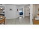 Hallway with tile floors leading to bedrooms and a bathroom at 3322 Purple Martin Dr # 127, Punta Gorda, FL 33950