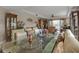 Open-concept living room with comfortable seating, ceiling fan, and access to a balcony at 3322 Purple Martin Dr # 127, Punta Gorda, FL 33950