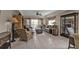 Comfortable living room featuring tile flooring, a ceiling fan, and access to outdoor balcony at 3322 Purple Martin Dr # 127, Punta Gorda, FL 33950