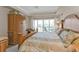 Spacious main bedroom with tray ceiling, ceiling fan, and balcony access at 3322 Purple Martin Dr # 127, Punta Gorda, FL 33950